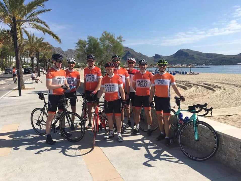 8 New Malden Velo members pictured near the beach for the tour de Mallorca.