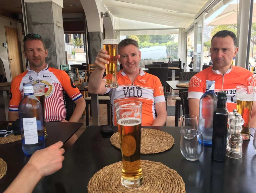 Simon celebrating a Tour de Mallorca ride with a pint with some members of NMV. 