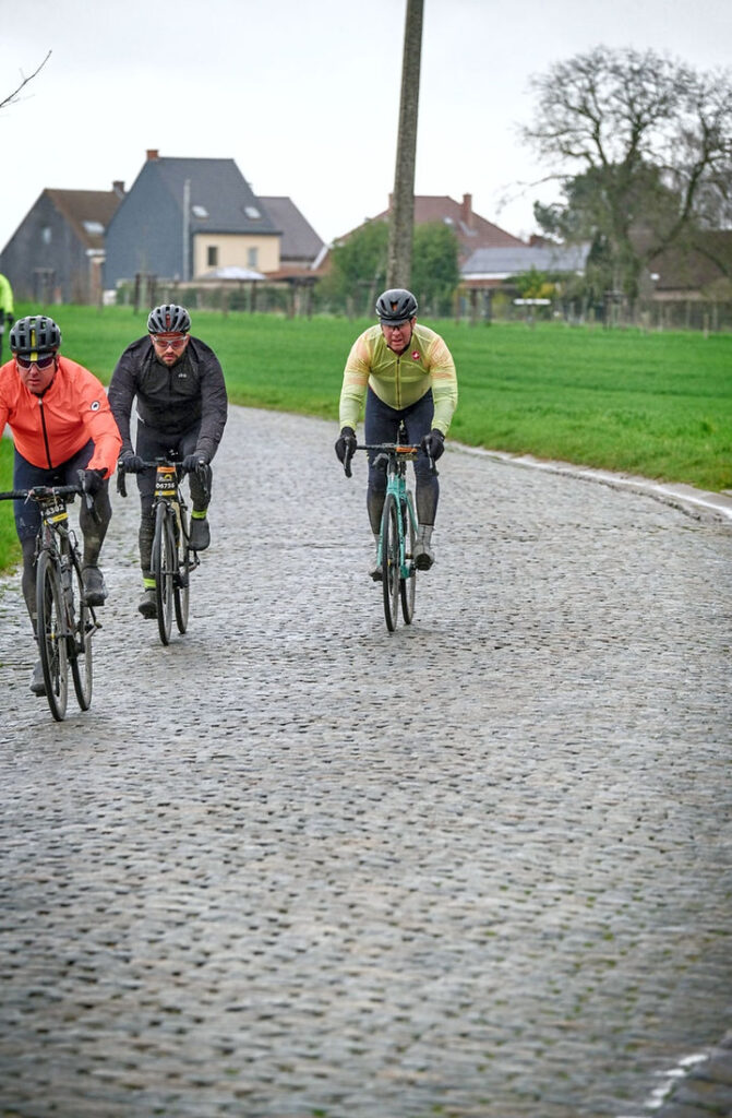 Cycling the Tour of Flanders on cobbles.